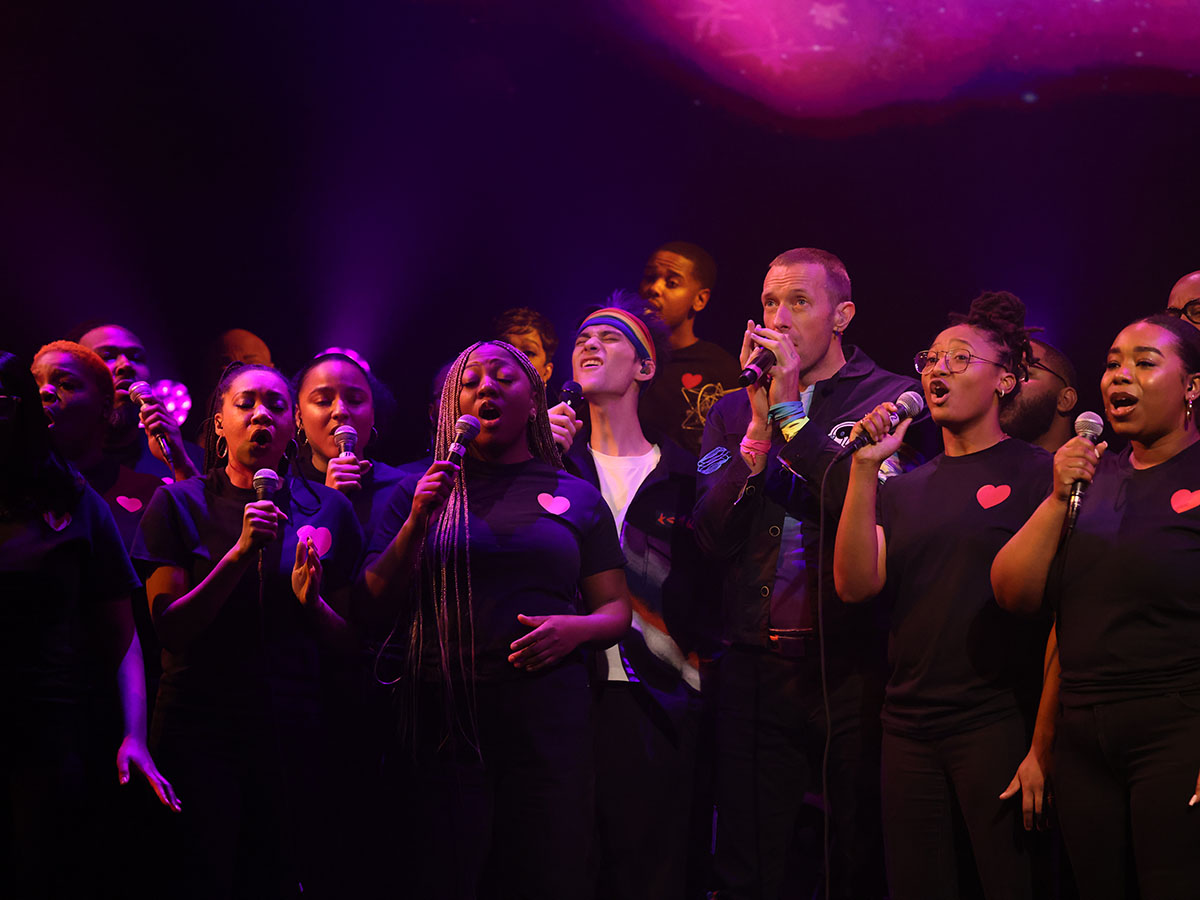 Jason Max Ferdinand singers perform at SNL with Jacob Collier and Coldplay